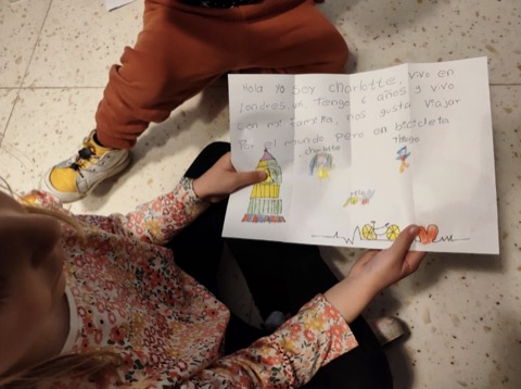 Child writing a letter in Spanish
