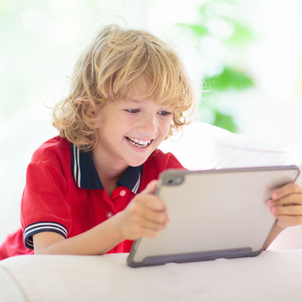 Boy in his one-to-one online Spanish literacy class with a native teacher