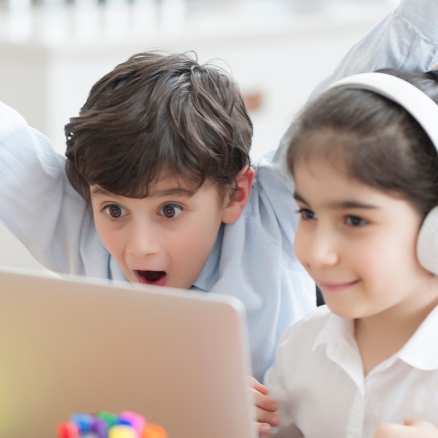 Young kids amazed during an online Spanish immersion class